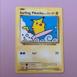 Surfing Pikachu Pokémon card.